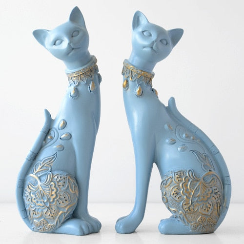 Witte en blauwe kattenbeeldjes